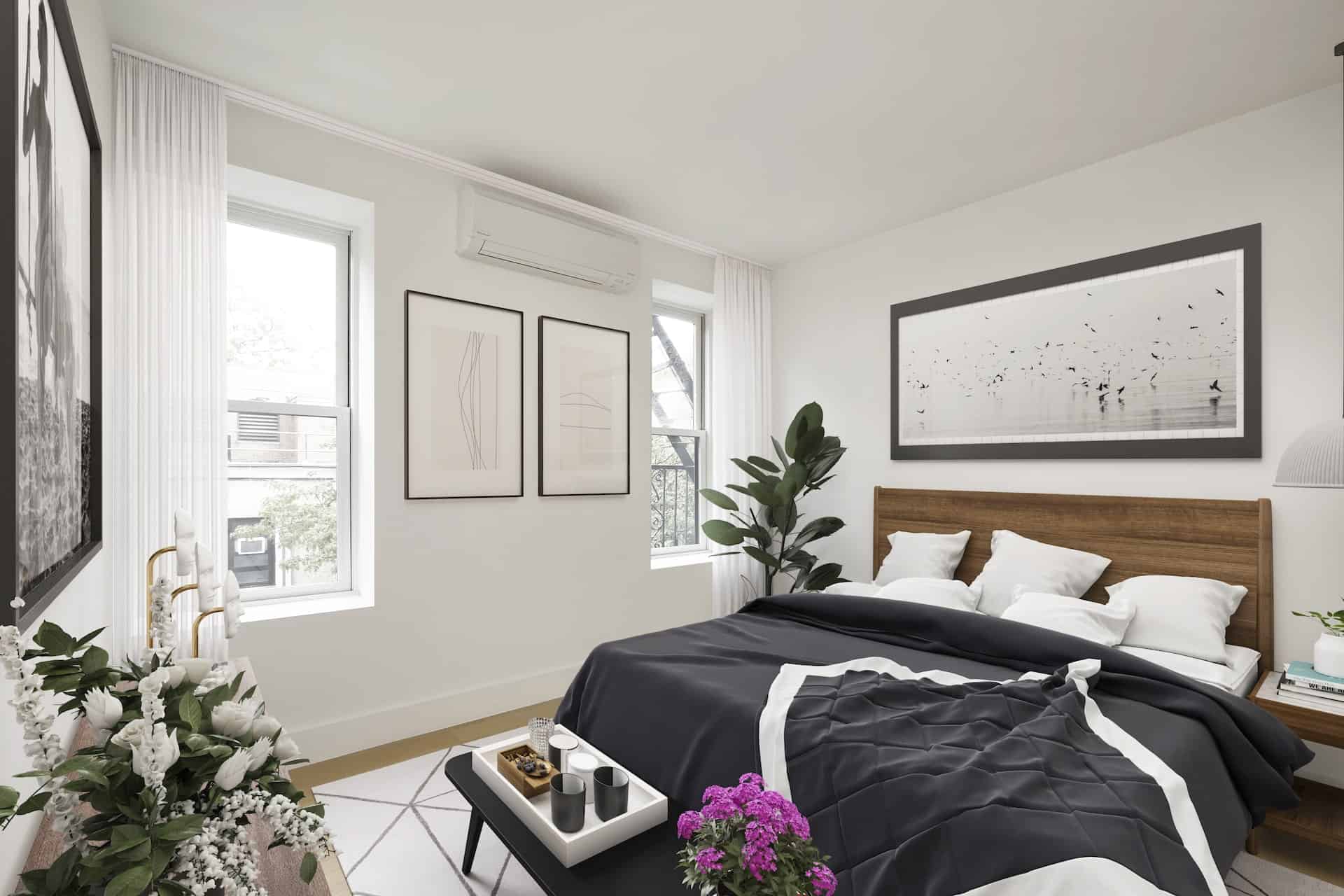 Bedroom at 236 West 10th Street apartments in the West Village with a king bed, side table, two windows and hardwood floors.