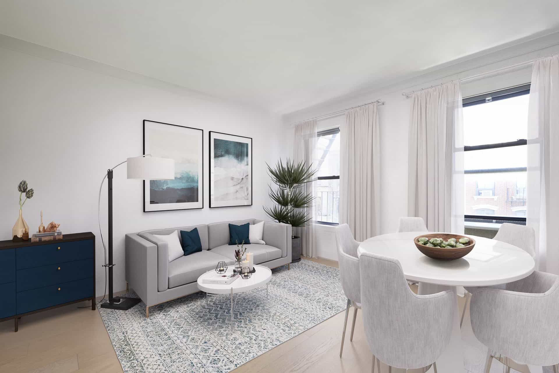 Living room at 245 East 30th Street apartments in Kips Bay with a couch, coffee table, windows and hardwood floors.