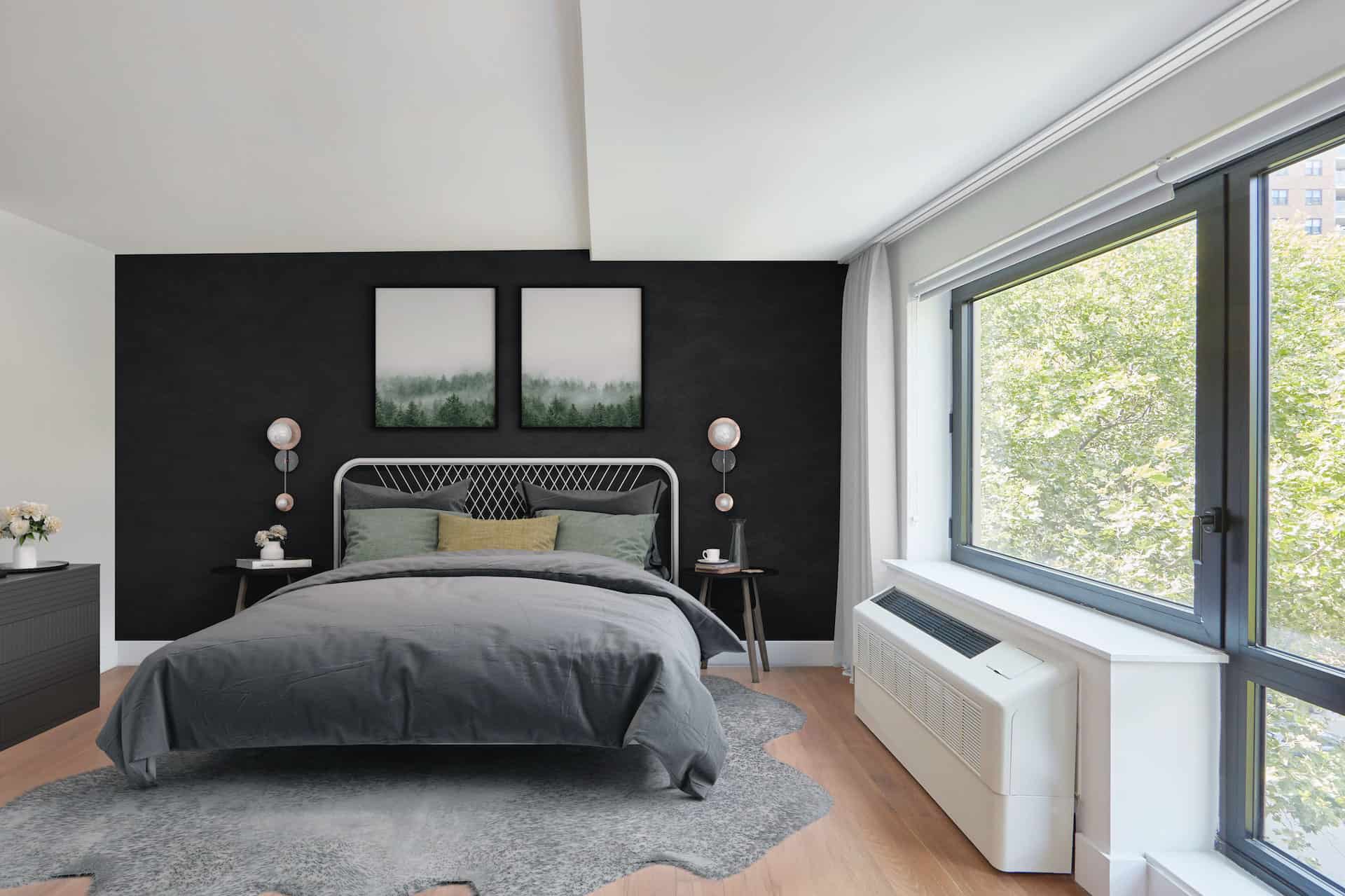Bedroom at 325 Lafayette Avenue apartments in Brooklyn with hardwood floors, large windows, a queen bed and side tables.