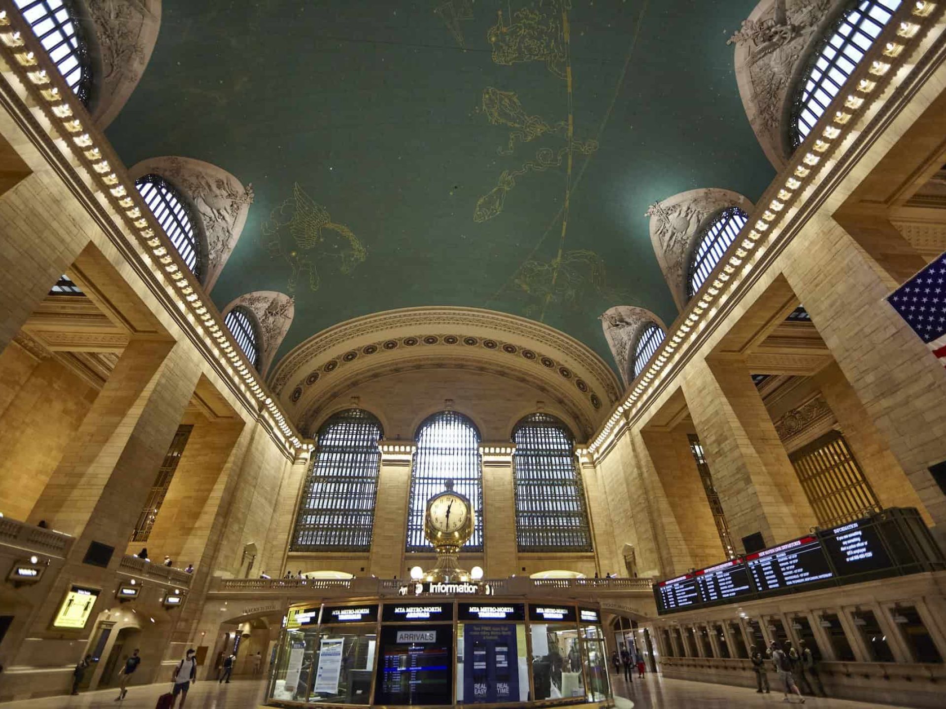 Inside the Grand Central Terminal looking up at the ceiling which depicts the winter sky with constellation figures.